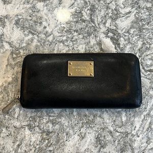 Michael Kors black and gold zip wallet large.